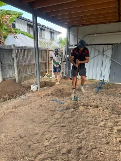 Trenching beside a new slab