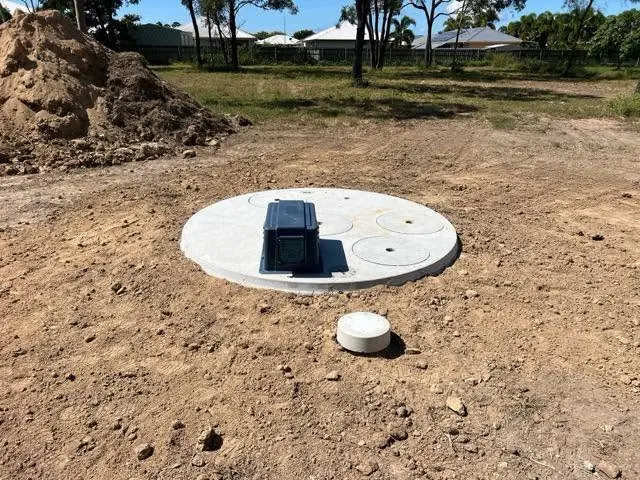 Concrete tank lid installed and backfilled