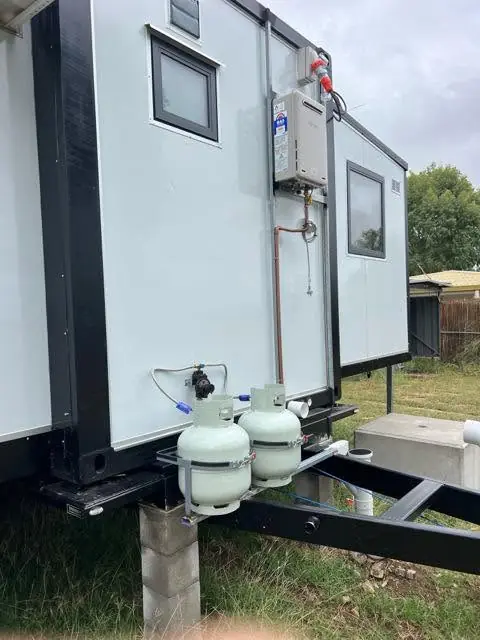 Gas bottles fitted to the side of a relocatable building
