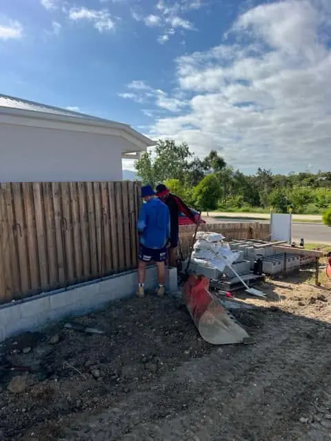 A tradie working on drainage at a new build